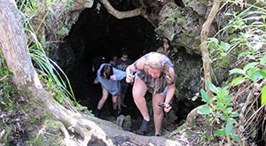 Exploring lava caves on Rangitoto Island - School field trip.