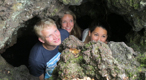 Rangitoto Volcanoes day trip. Students in lava caves.